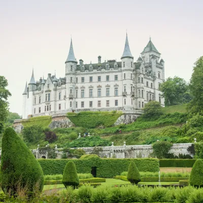 a castle on top of a lush green field